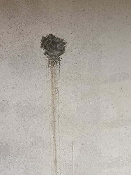 Leaking rod hole patched with hydraulic cement Failed hydraulic cement patch