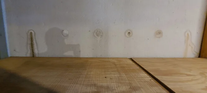 Leaking rod holes stained Bottom row rod holes leaking