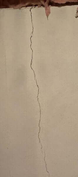 Vertical Poured concrete wall crack in basement Vertical Poured concrete wall crack in basement