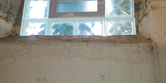 Basement window leaking at ledge Horizontal ledge crack leak
