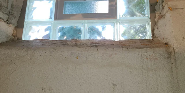Basement window leaking at ledge Horizontal ledge crack leak